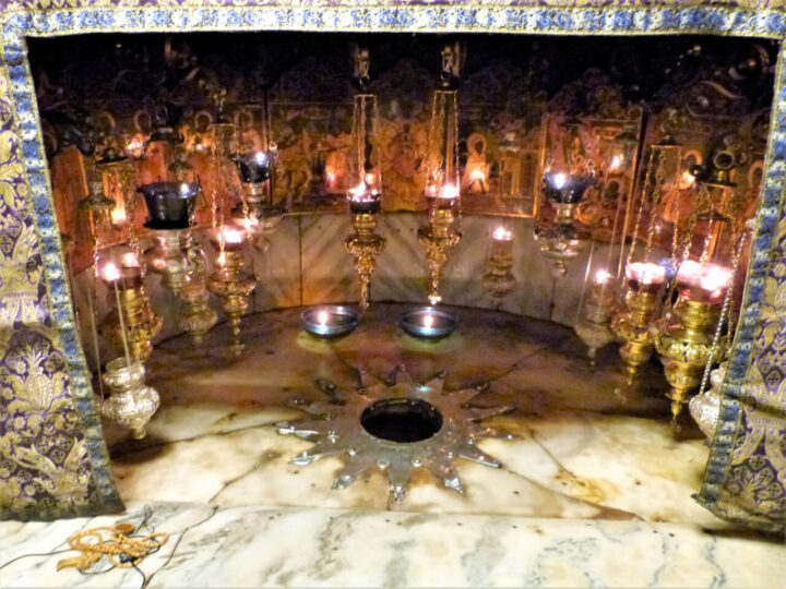 Star marker under ornate lamps and icons