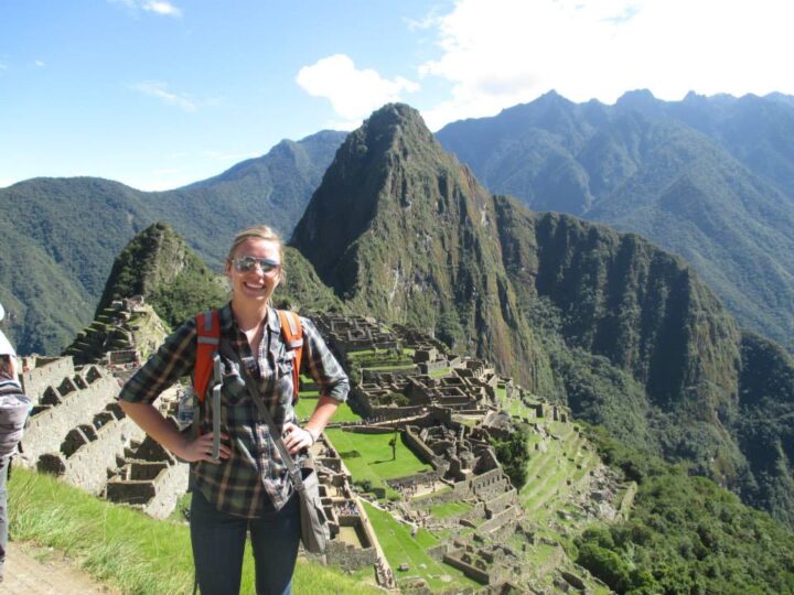 Tourist at Machu Picchu with mountains