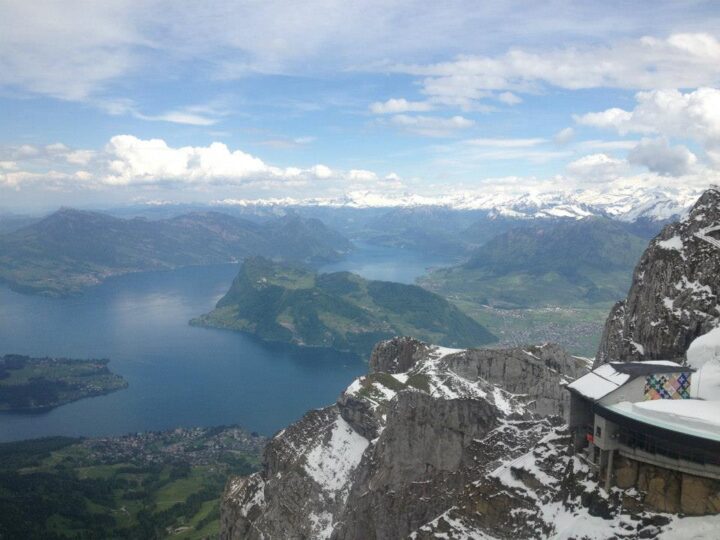 Aerial view of lake and snowy mountains